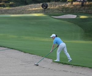 Superintendent Raking Bunker